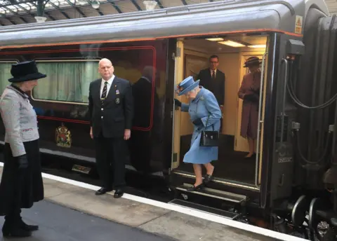 The Queen getting off the Royal Train