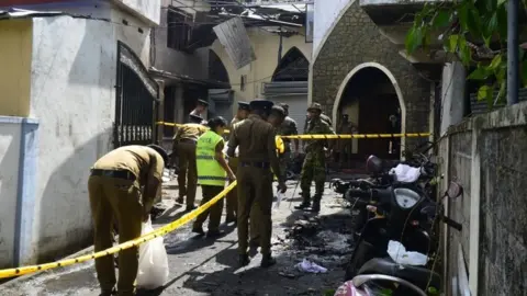 Getty Images The aftermath of a bomb blast at the Zion church