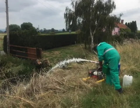 Environment Agency Environment Agency staff working to deal with the pollution