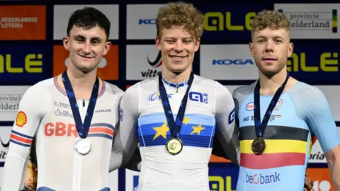 Great Britain's William Tidball, Denmark's Tobias Hansen and Belgium's Jules Hesters on the podium after the men's elimination race on day one of the 2024 European Track Cycling Championships