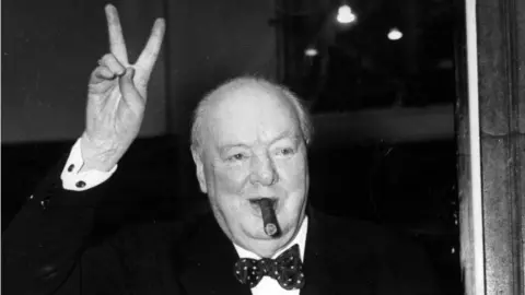 PA Media Winston Churchill with cigar