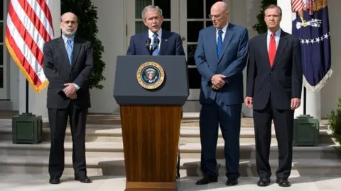 Getty Images Ben Bernanke, George W. Bush, Hank Paulson and Christopher Cox address the US in the week after the collapse of Lehman Brothers