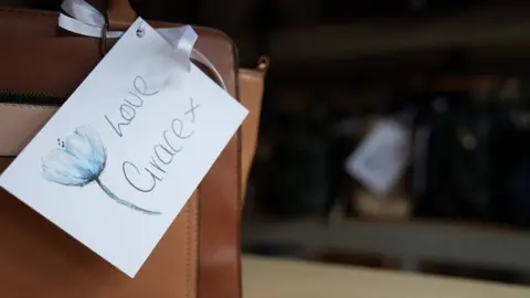 John Fairhall/BBC a Love Grace tag on a bag showing Grace's handwriting