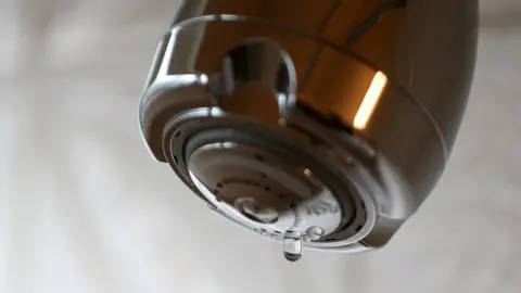 Getty Images Dripping shower head