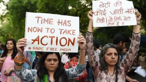 Getty Images Protest march in support of rape victims in India