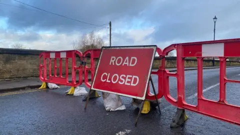 Rob Dowell/BBC Road closed sign Tadcastes