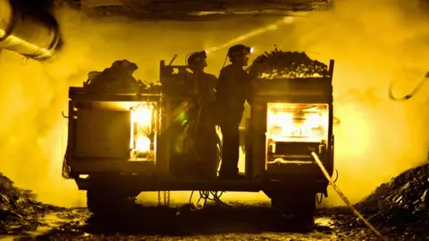 Getty Images Miners in a mine shaft