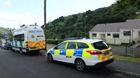 Wales News Service Police outside house in Elliotstown