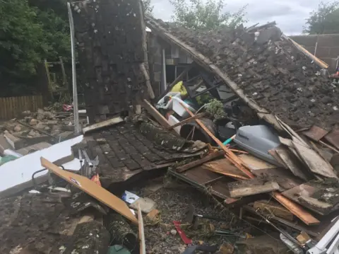 Debris left by a collapsed outdoor building