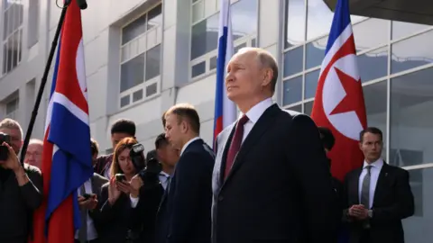 KREMLIN/REUTERS Russia's President Vladimir Putin waits to greet North Korea's leader Kim Jong Un during a visit to the Vostochny Сosmodrome in the far eastern Amur region, Russia, September 13, 2023.