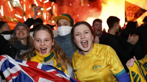 Getty Images Fans at Federation Square react after Australia scorers as they watch the Matildas FIFA World Cup Semi Final Game