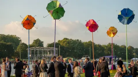 Henley Festival Umbrellas and people at the Henley Festival