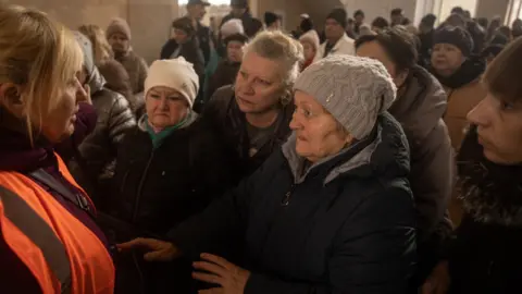 Getty Images Kherson residents at the railway station, waiting to be evacuated