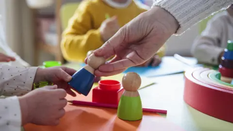 Getty Images Children play with blocks