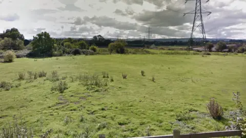 Google Maps An open view of the field where houses might be built