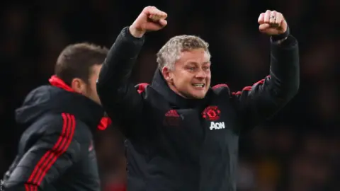 Ole Gunnar Solskjaer celebrates Manchester United's victory over Arsenal in the FA Cup
