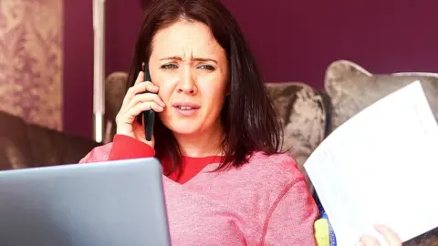 Getty Images Woman on phone to a call centre