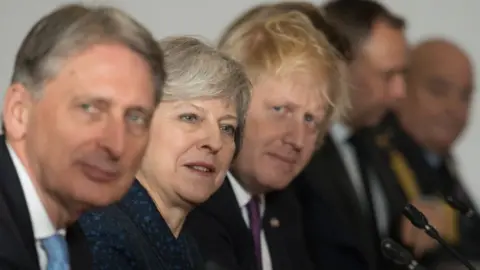 Getty Images Philip Hammond, Theresa May and Boris Johnson