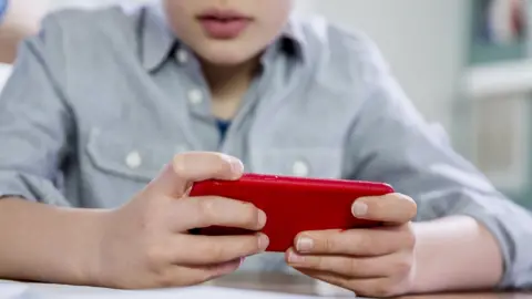 Getty Images Child on mobile phone