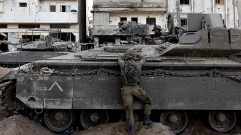 Reuters Israeli soldiers operate amid the ongoing ground invasion against Palestinian Islamist group Hamas in the northern Gaza Strip, on 8 November 2023