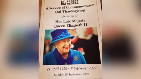 Katy Lewis/BBC Order of service for St Albans Cathedral service of commemoration and thanksgiving