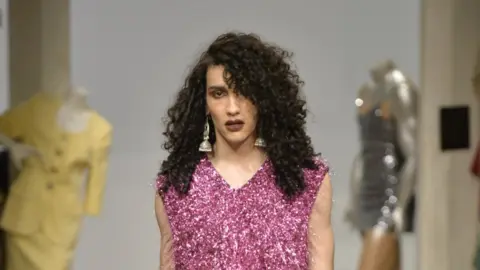 Ashish A male model with long curly hair