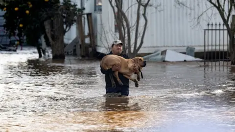 Getty Images Climate change is making extreme weather including flooding more likely, scientists say