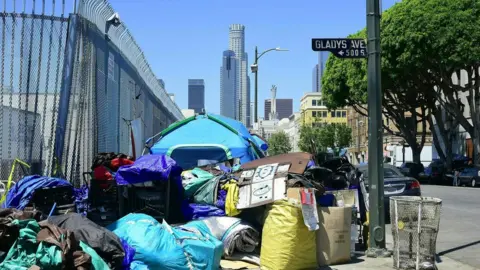 AFP Tents housing the homeless and their belongings crowd a street corner in Los Angeles, California on April 20, 2017