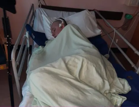 Cambs Police PC Leo Clarke in bed