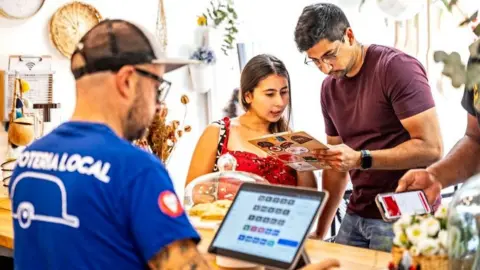 Getty Images people ordering at a restaurant