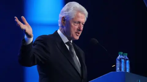 Adam Bettcher/Getty Images Bill Clinton takes the stage at the 2018 So the World May Hear Awards Gala benefitting Starkey Hearing Foundation at the Saint Paul RiverCentre on 15 July 2018 in St. Paul, Minnesota