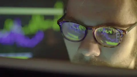 Getty Images Man looking at computer screen