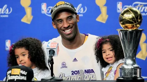 Reuters Kobe Bryant with daughters Gianna and Natalia after winning the 2010 NBA Finals basketball series in Los Angeles, California, in 2010