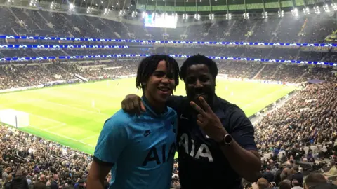 Luke McEwen Luke (right) and his son Jadan McEwen at a match between Tottenham Hotspur and Red Star Belgrade in October 2019.