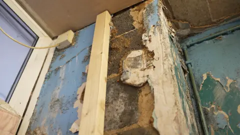 BBC News Damp damage to walls