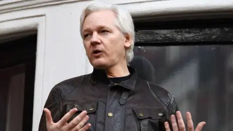 AFP Julian Assange speaking at the Ecuadorian embassy in London