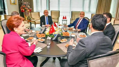 Alp Eren Kaya HANDOUT/EPA-EFE/REX/Shutterstock Republican People's Party (CHP) leader Kemal Kilicdaroglu (C-L), Saadet Party's leader Temel Karamollaoglu (C-R), leader of 'Good Party' (IYI) Meral Aksener (L), leader of Democracy and Progress Party (DEVA) Ali Babacan (2-R), Democratic Party leader Gultekin Uysal (R) and leader of Gelecek Party (Future Party) Ahmet Davutoglu (2-L) during their meeting in Ankara, Turkey, 26 January 2023