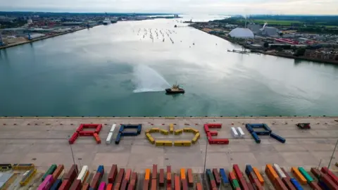 Andrew McAlpine/DP World Aerial photo of shipping containers at Southampton Docks that have been lined up to spell RIP ER