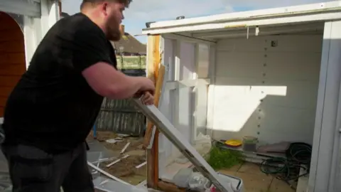 Oli clearing a garage