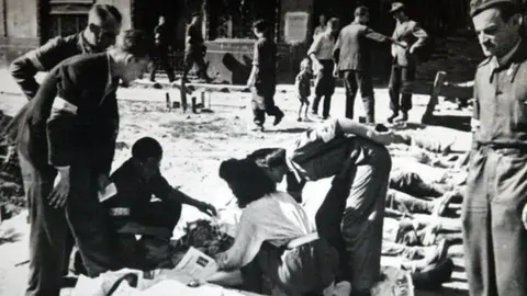 JANEK SKARZYNSKI Bodies lined up in the streets of Warsaw in 1944