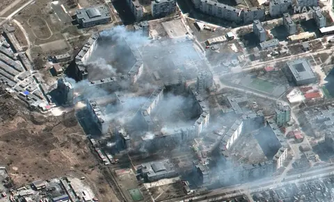 Getty Images satellite image of burning apartment buildings in northeastern Mariupol, Ukraine, 19 march 2022