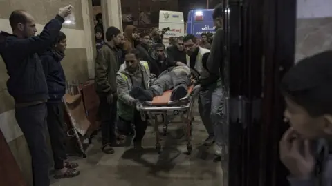 EPA An injured man is brought to Nasser Hospital in Khan Younis, in the southern Gaza Strip (16 January 2024)