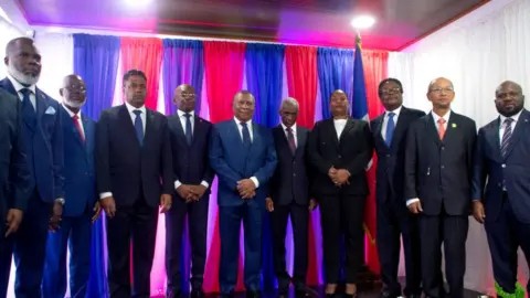 Getty Images Members of Haiti's new transitional council pose after being sworn in