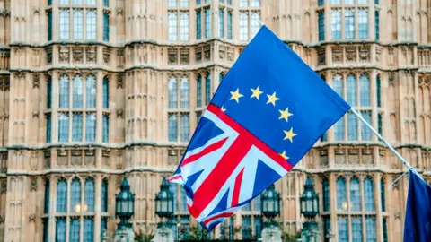 Getty Images EU and UK flag outside Parliament