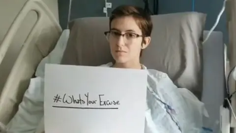 Maddison Yetman Maddison holds up #Whatsyourexcuse sign from hospital bed