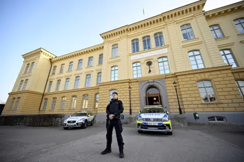 Reuters Police officer outside the school in Malmo