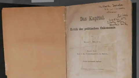 An old copy of Karl Marx's "Das Kapital". First page, with inscription written on it.