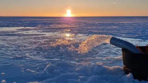 Real Ice Seawater pump floods the surface of the sea ice with seawater as the Sun sets