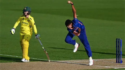 Getty Images Jhulan Goswami of India bowls during the 2022 ICC Women's Cricket World Cup match between India and Australia at Eden Park on March 19, 2022 in Auckland, New Zealand.