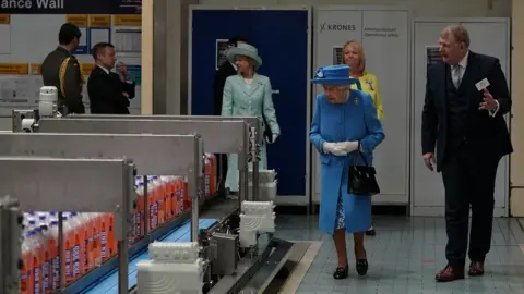 PA Media The Queen at the bottling plant